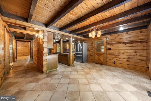 74 Madison Rd, Elmer, NJ 08318 - kitchen with high end refrigerator, wood walls, wooden ceiling with exposed beams, a chandelier, and light countertops