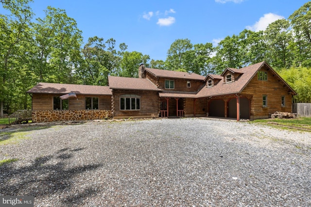 74 Madison Rd, Elmer, NJ 08318 - log home with a garage, a chimney, gravel driveway, and log siding