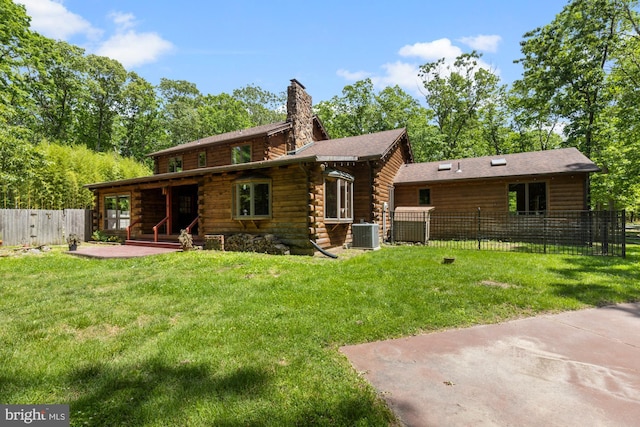 74 Madison Rd, Elmer, NJ 08318 - back of property with central AC, a patio area, a chimney, and log siding