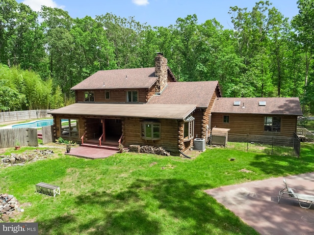 74 Madison Rd, Elmer, NJ 08318 - back of property with a chimney, central AC unit, a patio, and log exterior
