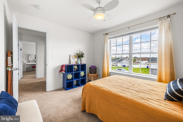 bedroom with ceiling fan, baseboards, and carpet
