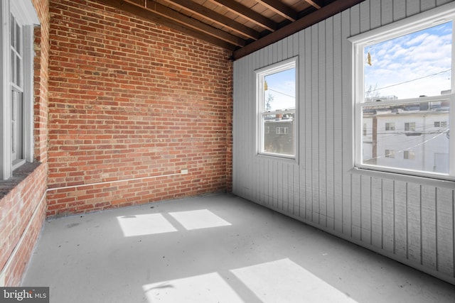 unfurnished sunroom featuring a wealth of natural light