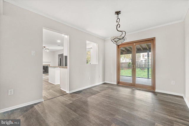 8794 Inspiration Ct, Walkersville, MD 21793 - unfurnished dining area with baseboards, dark wood-style flooring, crown molding, and visible vents