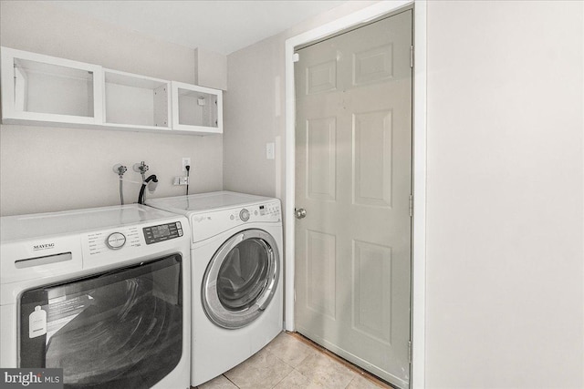 8794 Inspiration Ct, Walkersville, MD 21793 - washroom with washer and dryer, laundry area, and light tile patterned flooring