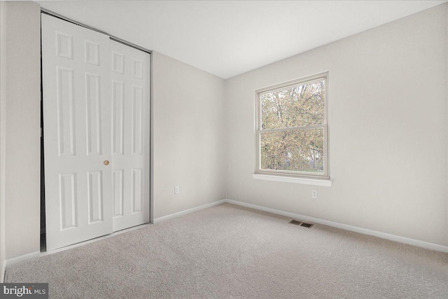 8794 Inspiration Ct, Walkersville, MD 21793 - unfurnished bedroom with a closet, carpet, visible vents, and baseboards