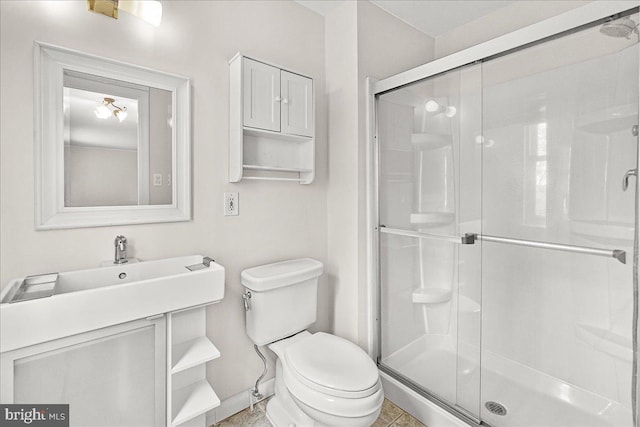 8794 Inspiration Ct, Walkersville, MD 21793 - bathroom featuring a stall shower, baseboards, a sink, and toilet