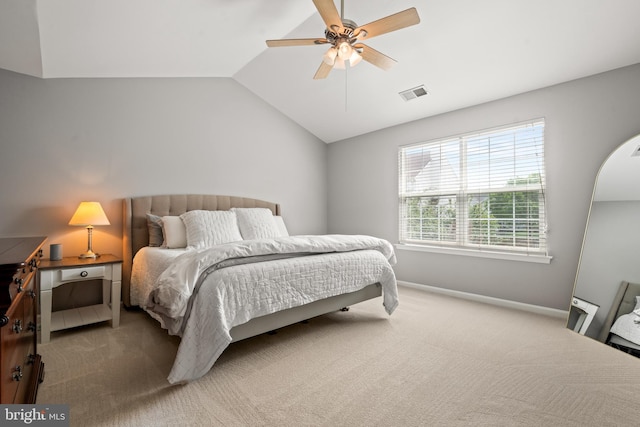 bedroom featuring visible vents, baseboards, a ceiling fan, carpet, and vaulted ceiling