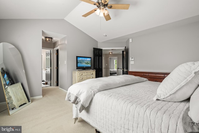 bedroom featuring baseboards, ceiling fan, vaulted ceiling, and light carpet