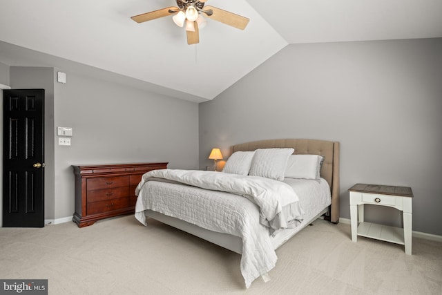 carpeted bedroom with baseboards, a ceiling fan, and vaulted ceiling