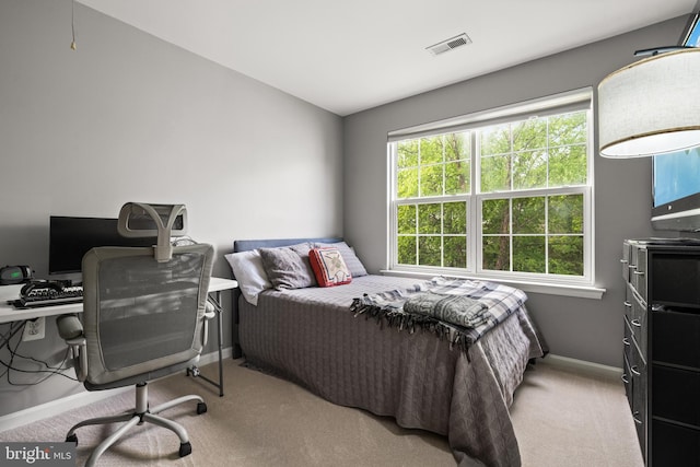 bedroom featuring carpet floors, baseboards, and visible vents