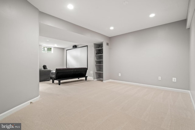 interior space featuring baseboards, recessed lighting, and light colored carpet