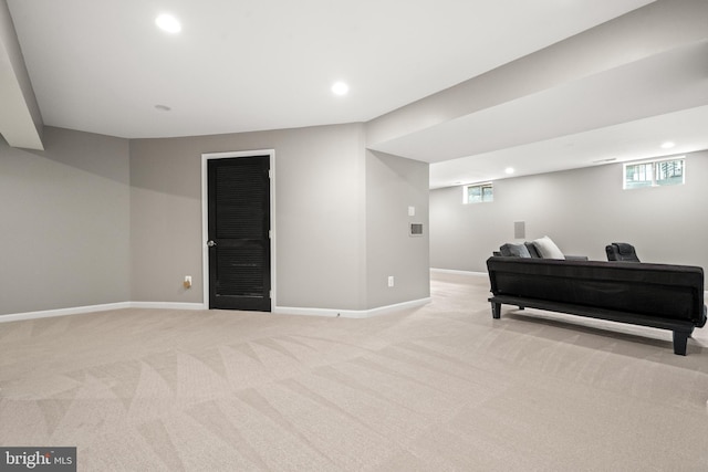 interior space featuring recessed lighting, baseboards, and light carpet