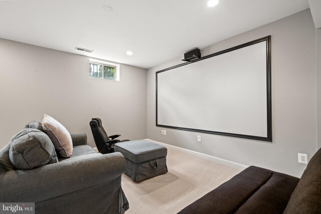 carpeted cinema room featuring baseboards, recessed lighting, and visible vents