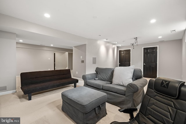 living area with recessed lighting, baseboards, light colored carpet, and visible vents