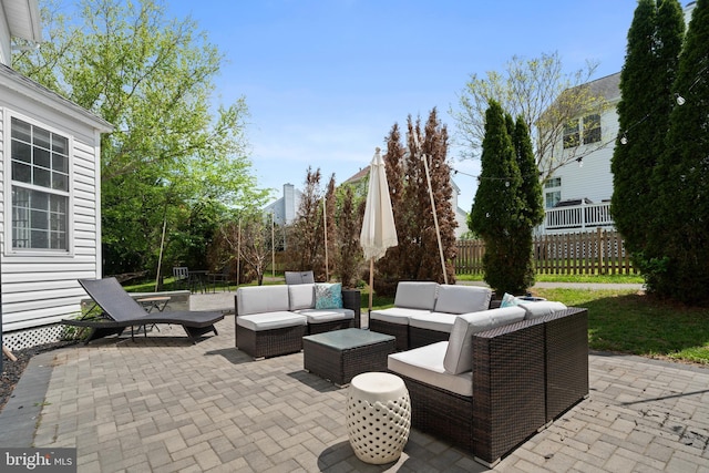 view of patio with fence and an outdoor living space