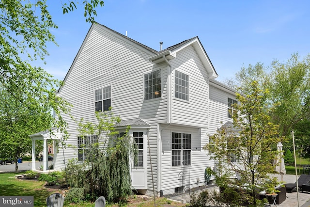 view of property exterior featuring a patio