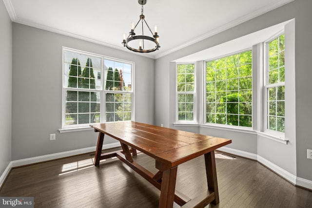 dining area featuring visible vents, crown molding, dark wood finished floors, baseboards, and a chandelier