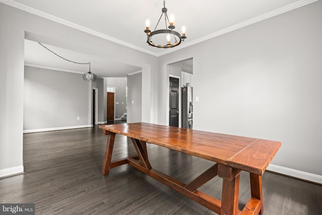 unfurnished dining area featuring baseboards, dark wood-type flooring, and a notable chandelier