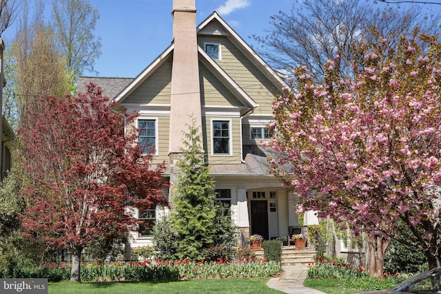 craftsman inspired home with a chimney