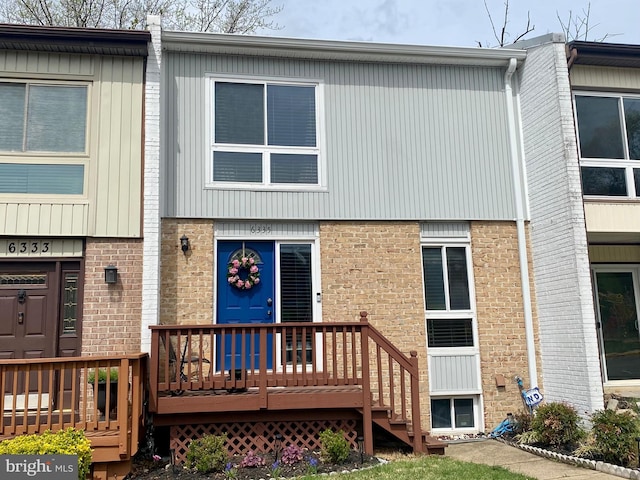 view of front of home with brick siding