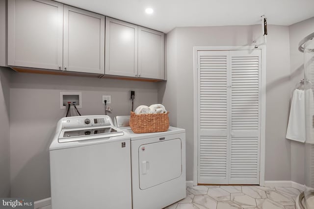 6335 Rockshire St, Alexandria, VA 22315 - laundry room featuring washing machine and clothes dryer, cabinet space, baseboards, and light marble finish flooring