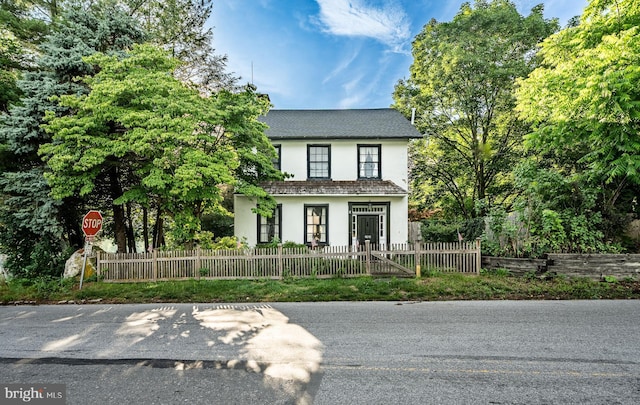 4870 Homeville Rd, Cochranville, PA 19330 - view of front facade featuring stucco siding and a fenced front yard