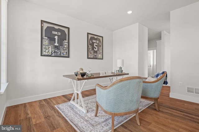 office area with baseboards, recessed lighting, visible vents, and wood finished floors