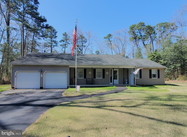 ranch-style house with driveway, a front yard, a porch, and a garage