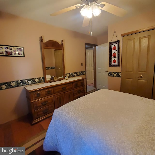 bedroom with wood finished floors and a ceiling fan