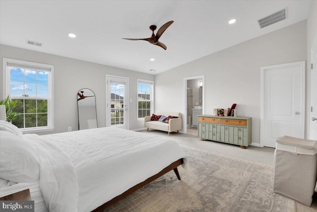 bedroom with vaulted ceiling, light colored carpet, visible vents, and recessed lighting