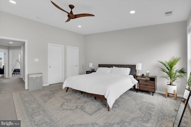carpeted bedroom with ceiling fan, baseboards, visible vents, and recessed lighting