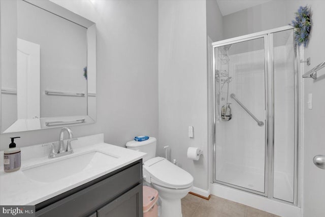 full bathroom featuring a stall shower, vanity, toilet, and tile patterned floors
