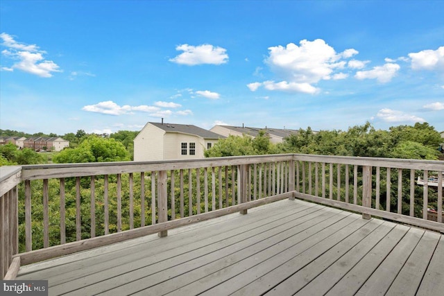 wooden deck with a residential view