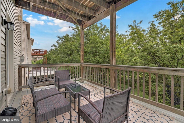 wooden deck with outdoor lounge area