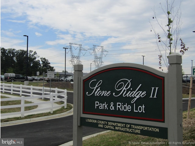 community sign with fence