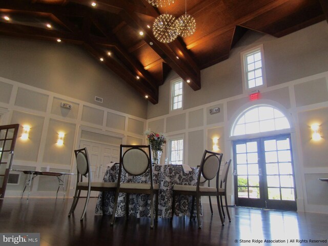 dining room featuring french doors, high vaulted ceiling, visible vents, a chandelier, and beamed ceiling