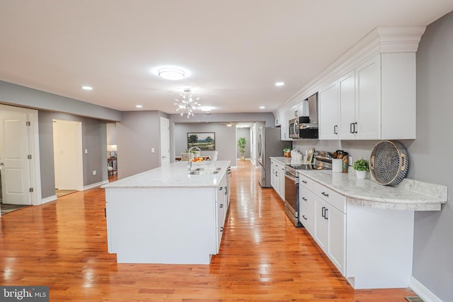 1111 S Mountain Rd, Dillsburg, PA 17019 - kitchen featuring stainless steel appliances, light wood-type flooring, white cabinetry, a chandelier, and recessed lighting