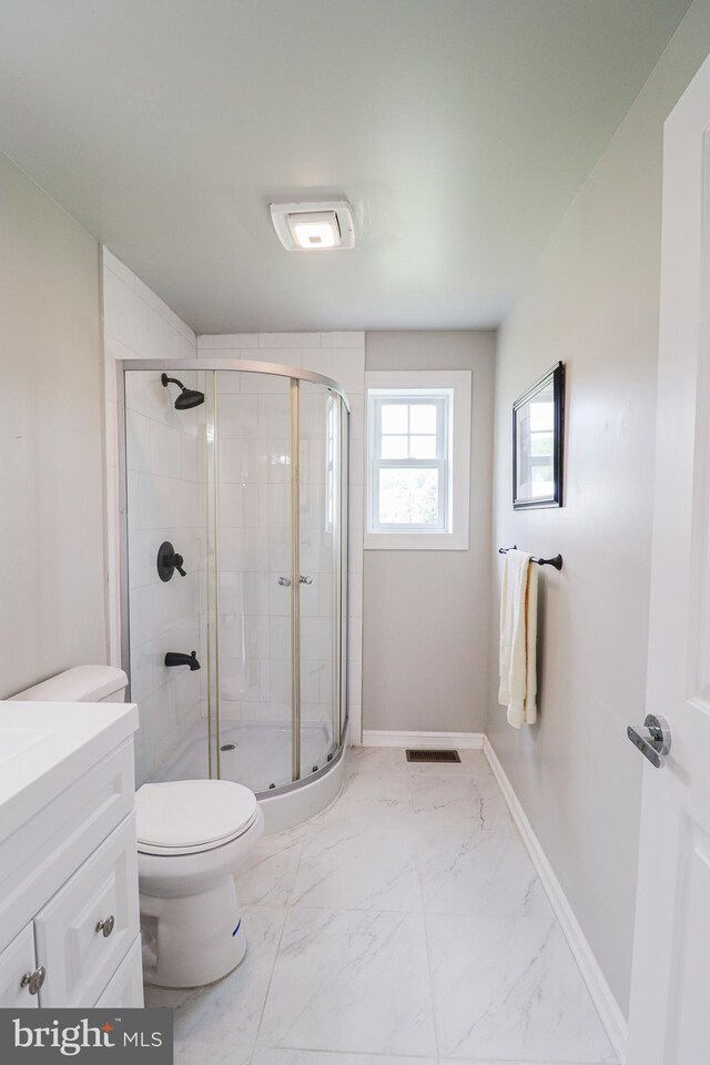 1111 S Mountain Rd, Dillsburg, PA 17019 - bathroom featuring a shower stall, toilet, marble look tiles, and vanity