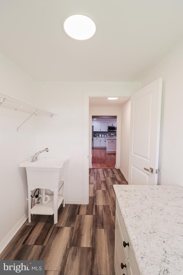 1111 S Mountain Rd, Dillsburg, PA 17019 - laundry area featuring dark wood finished floors and baseboards