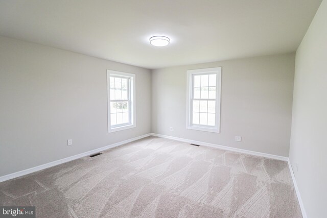 1111 S Mountain Rd, Dillsburg, PA 17019 - empty room with healthy amount of natural light, light colored carpet, and baseboards