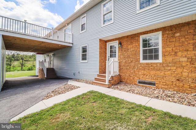 1111 S Mountain Rd, Dillsburg, PA 17019 - entrance to property with stone siding, a lawn, and a balcony