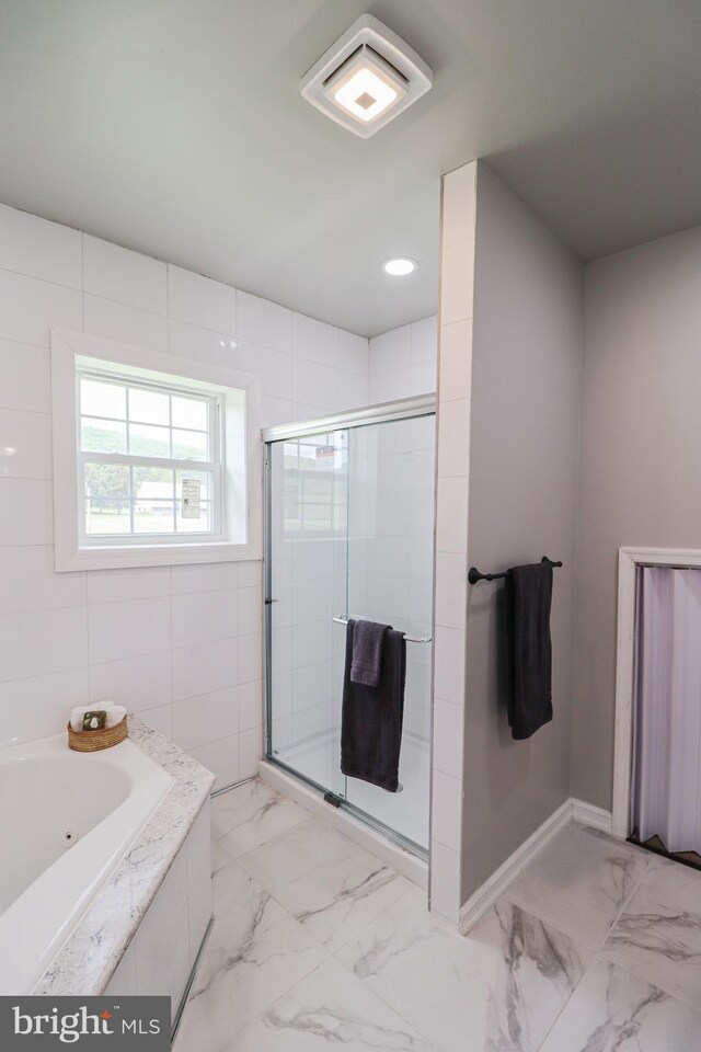 1111 S Mountain Rd, Dillsburg, PA 17019 - bathroom featuring a shower stall, marble finish floors, a tub with jets, and baseboards