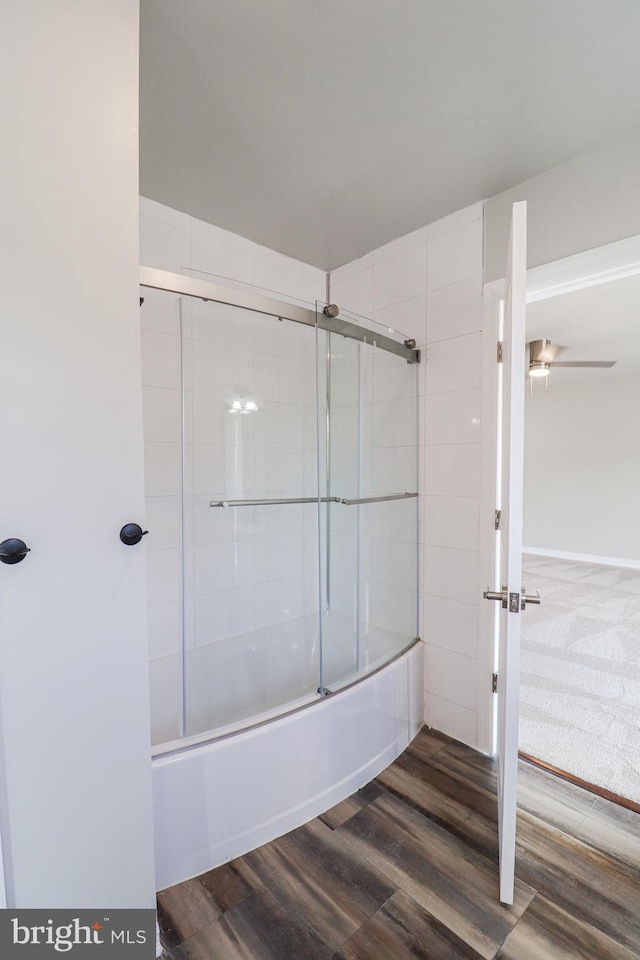 1111 S Mountain Rd, Dillsburg, PA 17019 - bathroom featuring wood finished floors, enclosed tub / shower combo, and a ceiling fan