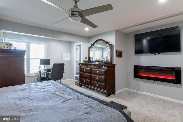 617 Castlewood Dr, Upper Marlboro, MD 20774 - bedroom with baseboards, a glass covered fireplace, carpet floors, and recessed lighting