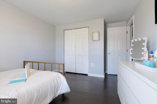 617 Castlewood Dr, Upper Marlboro, MD 20774 - bedroom featuring baseboards, a closet, and dark wood-style floors