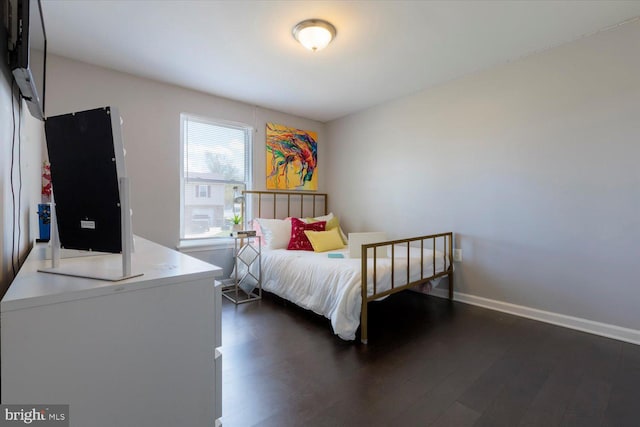 617 Castlewood Dr, Upper Marlboro, MD 20774 - bedroom with baseboards and dark wood-style flooring