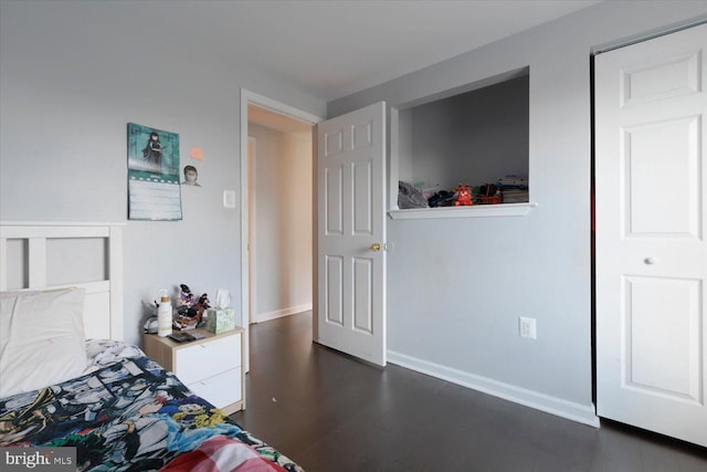 617 Castlewood Dr, Upper Marlboro, MD 20774 - bedroom featuring dark wood-type flooring and baseboards