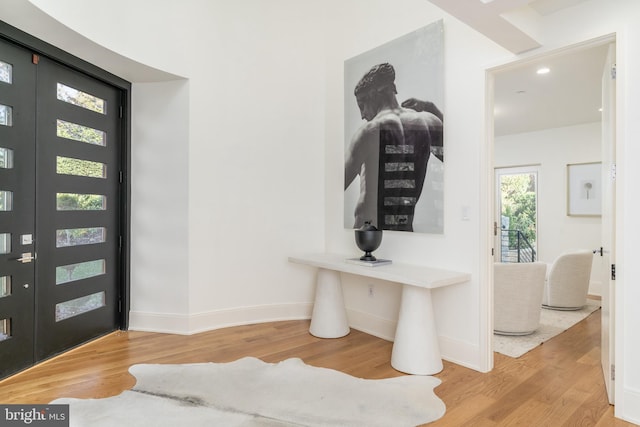 entrance foyer with baseboards, recessed lighting, and wood finished floors
