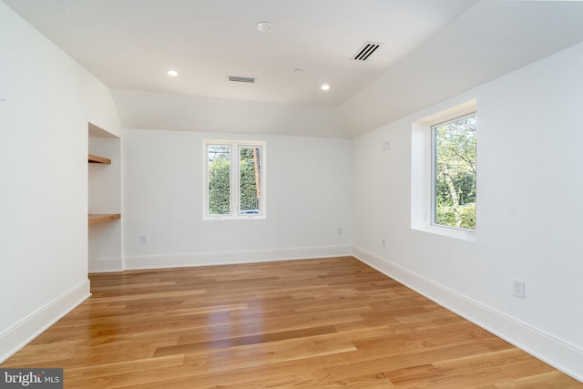 unfurnished room featuring visible vents, baseboards, light wood-type flooring, and recessed lighting