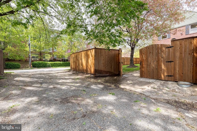 view of patio with a gate and fence